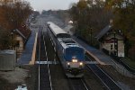 AMTK 4 leads the Southwest Chief through the station at Highlands